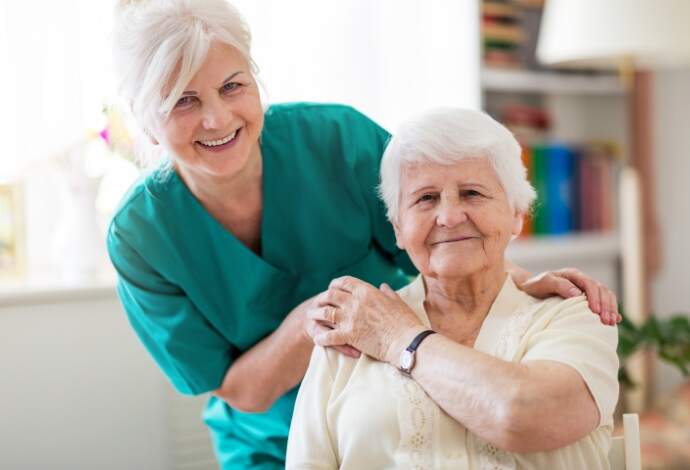 PT HR Large Min | image of two elderly ladies embracing and smiling