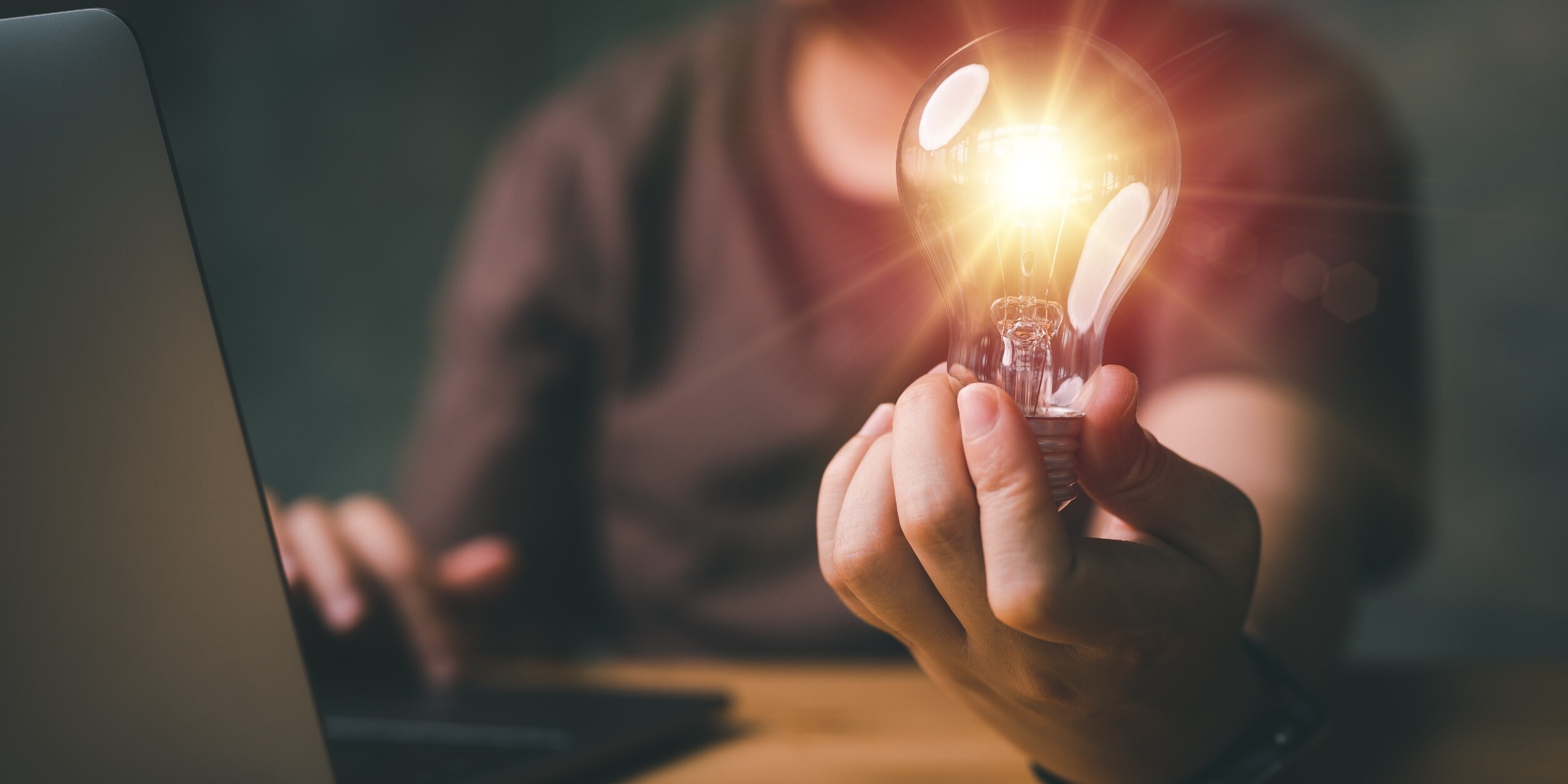 Pioneer Talent Image showing a lightbulb illuminating a dark room